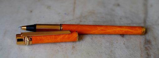 STYLO ROLLER CARTIER TRINITY EN LAQUE ORANGE MARBREE & PL. OR 18 CARATS - RARE VERSION